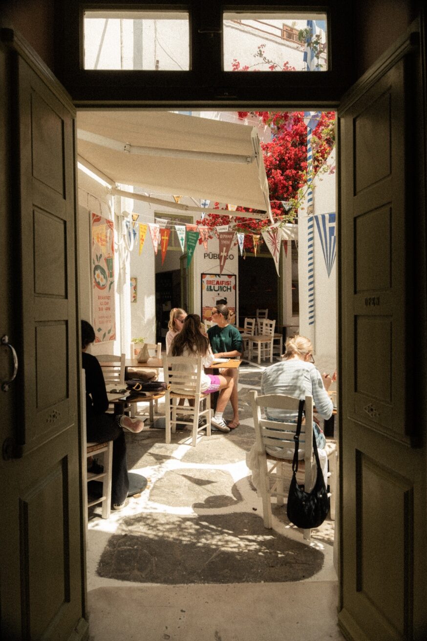 Guests enjoying morning drinks at Mykonos Brunch Club outdoor terrace Mykonos Town