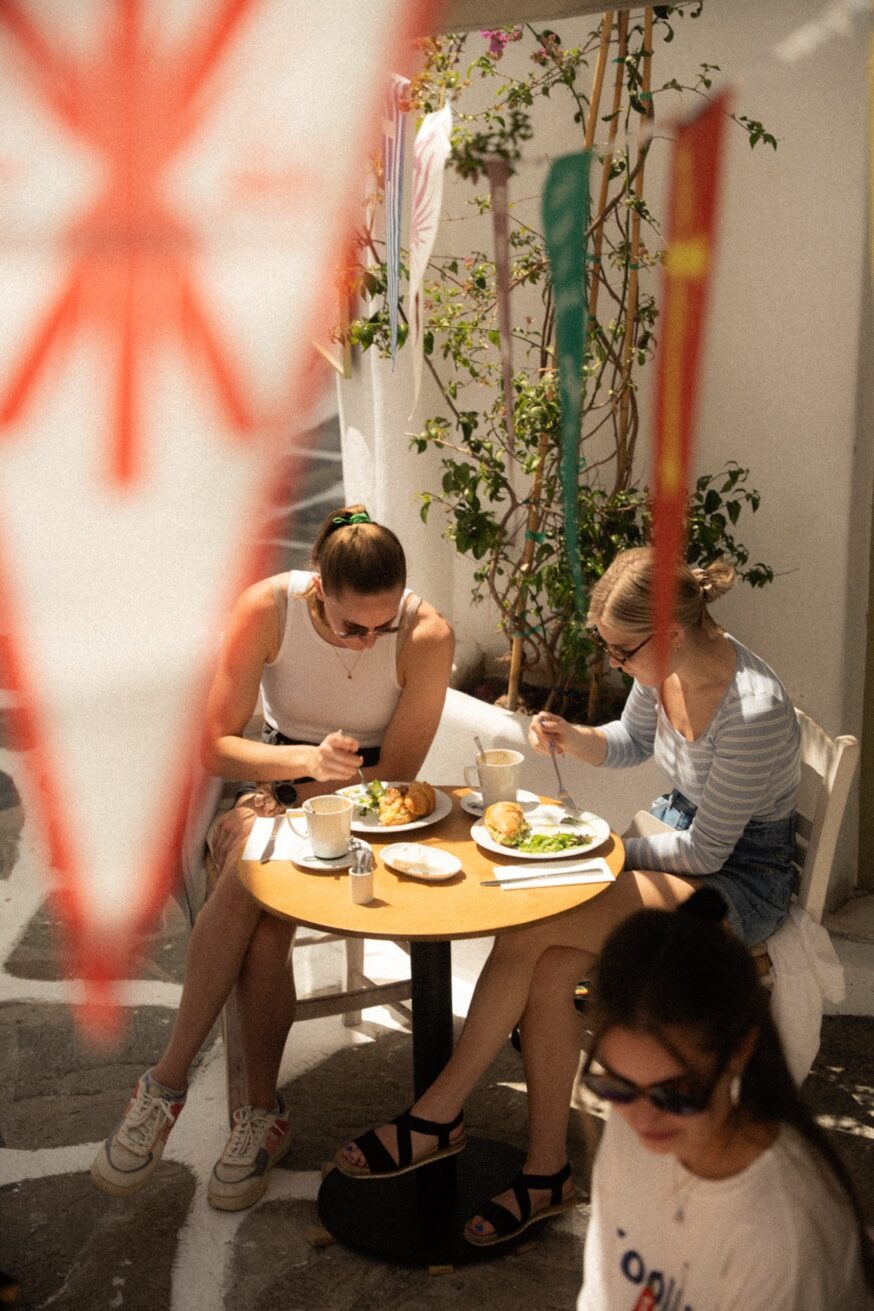 Guests enjoying morning brunch on the terrace at Mykonos Brunch Club Mykonos Town
