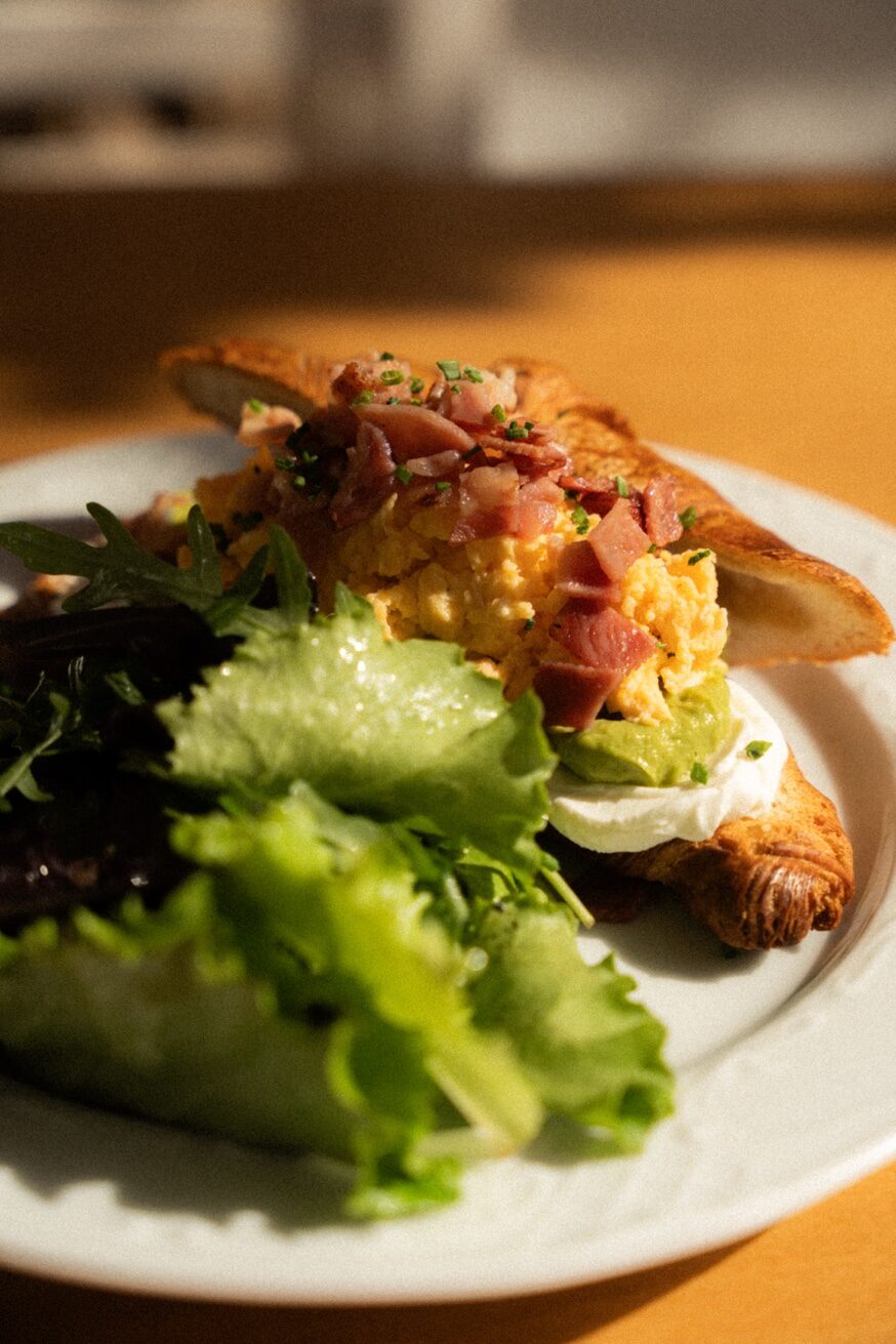 Eggs Benedict with house-made hollandaise on artisanal sourdough at Mykonos Brunch Club