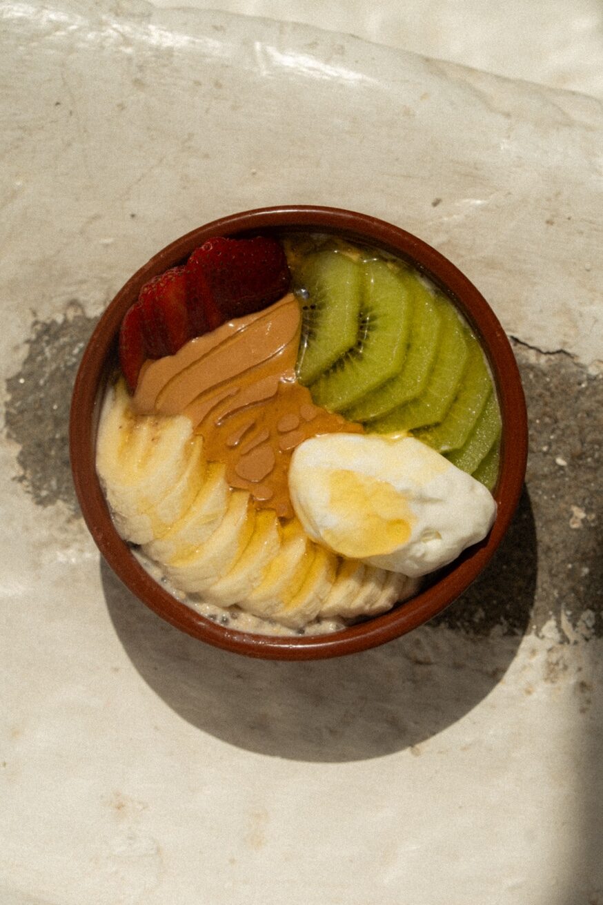 Staff member serving a drink at Mykonos Brunch Club Mykonos Town