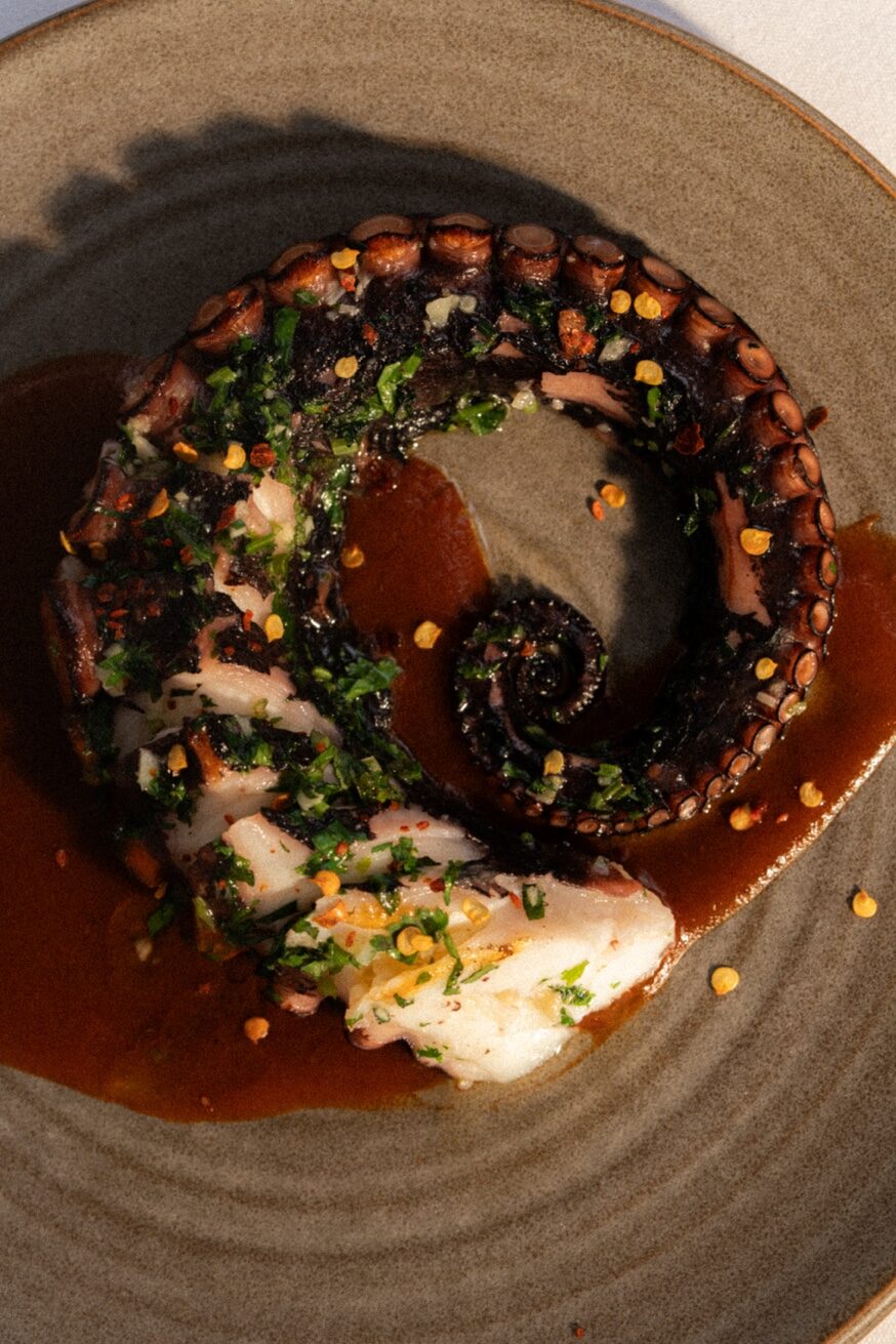Chargrilled octopus with chimichurri at Pūblico Restaurant Mykonos
